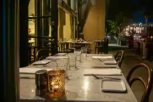 Thumbnail of inviting outdoor seating at Bistro Elan, located near California Avenue in Palo Alto, features comfortable tables and chairs on its patio.