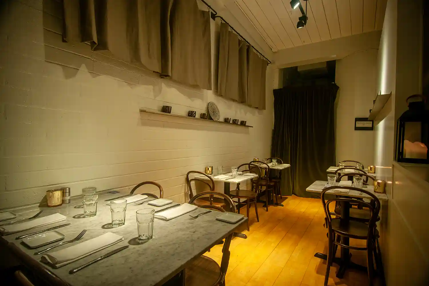 View of tables on right side of restaurants - thumb